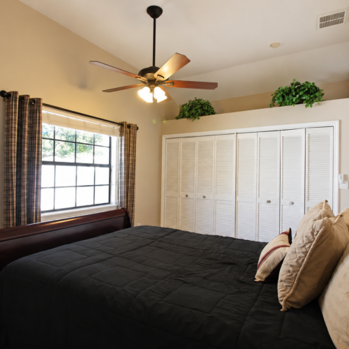 Project Archive addition cozy bedroom with warm lighting.webp