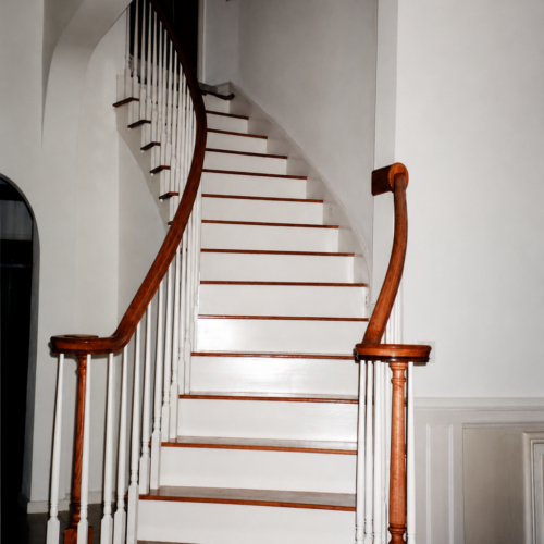 Project Archive addition curved staircase in elegant interior