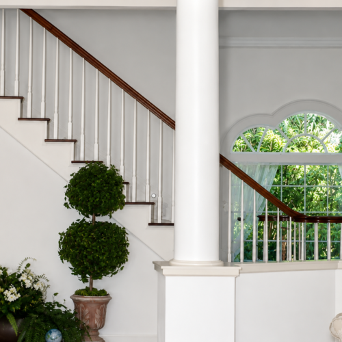 Project Archive addition elegant foyer with staircase and plants.webp