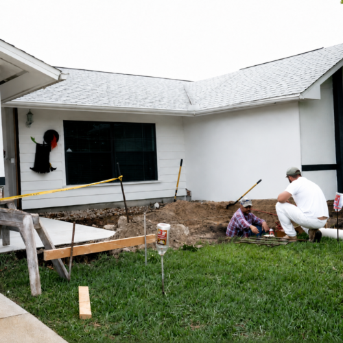 Project Archive addition home under construction with landscaping work.webp