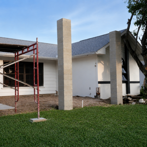 Project Archive addition residential construction with scaffolding and greenery.webp