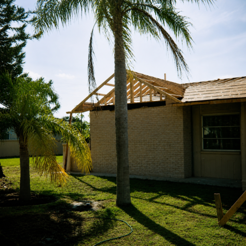 Project Archive addition sunny backyard construction in progress.webp