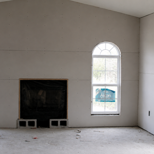 Project Archive addition unfinished room under construction with natural light.webp