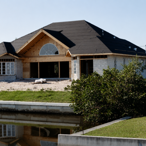 Project Archive custom home duplex under construction by the water