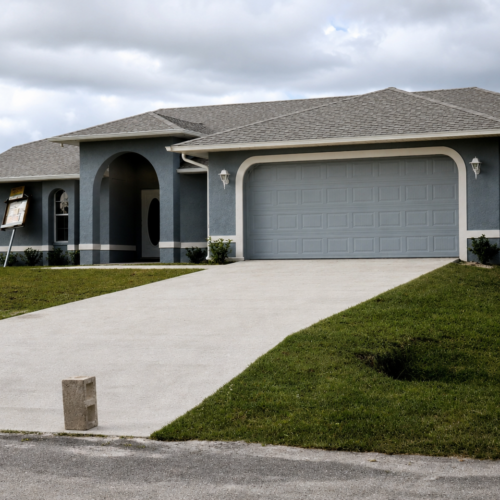 Project Archive custom home suburban house with front driveway