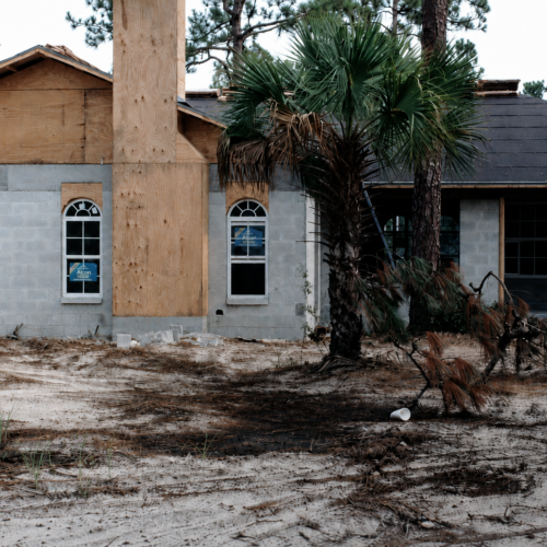 Project Archive custom home under construction in a wooded area