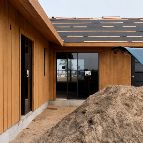 Project Archive custom home wooden house under construction in daylight