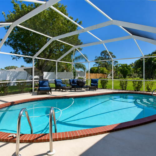 Project Archive outdoor sunny poolside retreat in a garden