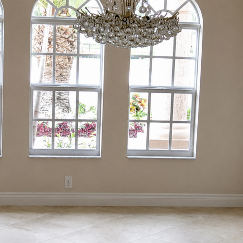 Project Archive renovation minimalist room with chandelier and windows